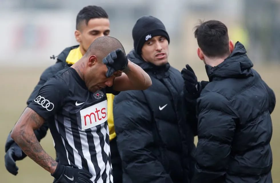 Partizan Belgrade's Brazilian player Everton Luiz, left, leaves the field during a Serbian championship match between Rad and Partizan, in Belgrade, Serbia, Sunday, Feb. 19, 2017.  Luiz was in tears after suffering persistent racist chants during his team