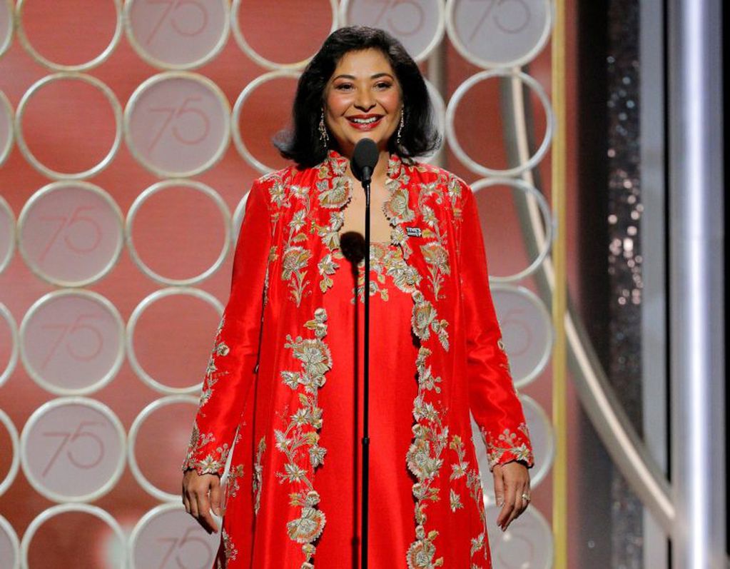 This image released by NBC shows Hollywood Foreign Press Association President Meher Tatna at the 75th Annual Golden Globe Awards in Beverly Hills, Calif., on Sunday, Jan. 7, 2018. (Paul Drinkwater/NBC via AP)