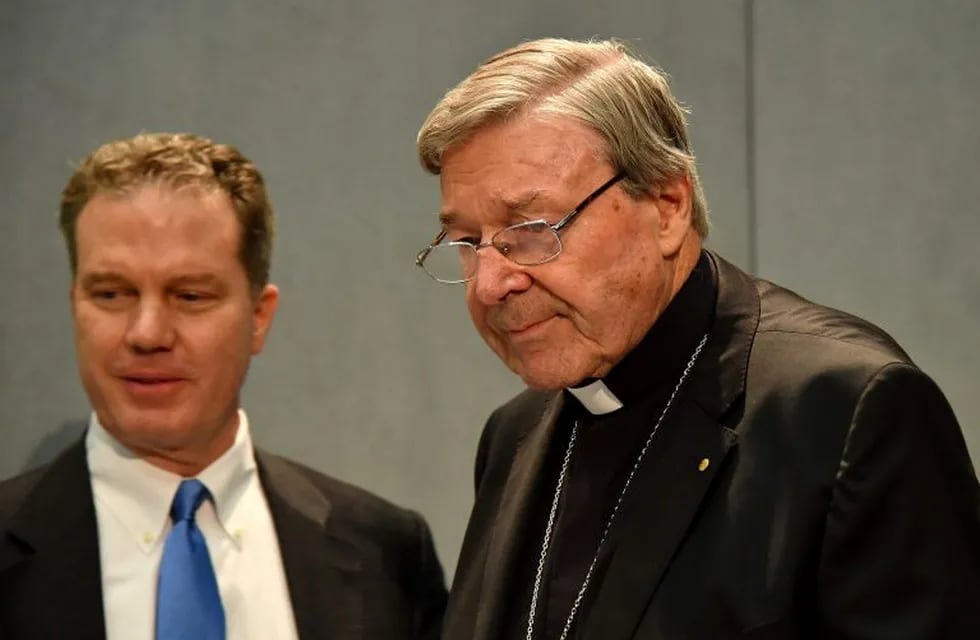 Australian Cardinal George Pell (R), flanked by Vatican press office director Greg Burke, arrives to deliver a statement at the Holy See Press Office, Vatican city, on June 29, 2017 after being charged with historical sex offences in a case that has rocked the church. \nCardinal George Pell said on June 29 that he would take leave from the Vatican to return to Australia to fight sexual assault charges after being given strong backing from Pope Francis, who has not asked him to resign from his senior Church post. Pell strongly denies the allegations, details of which were not given by police. / AFP PHOTO / Alberto PIZZOLI