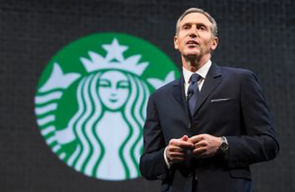 (FILES) This file photo taken on March 17, 2015 shows Starbucks Chairman and CEO Howard Schultz as he speaks during Starbucks annual shareholders meeting in Seattle, Washington.  nUS President Donald Trump's border clampdown has stirred Starbucks and Airb