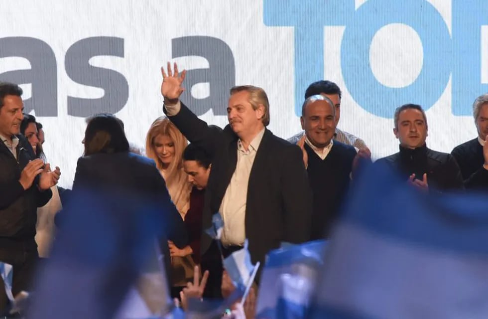 11 August 2019, Argentina, Buenos Aires: Argentinian presidential candidate Alberto Fernandez (C) celebrates after winning the primary election. Photo: Julieta Ferrario/ZUMA Wire/dpa