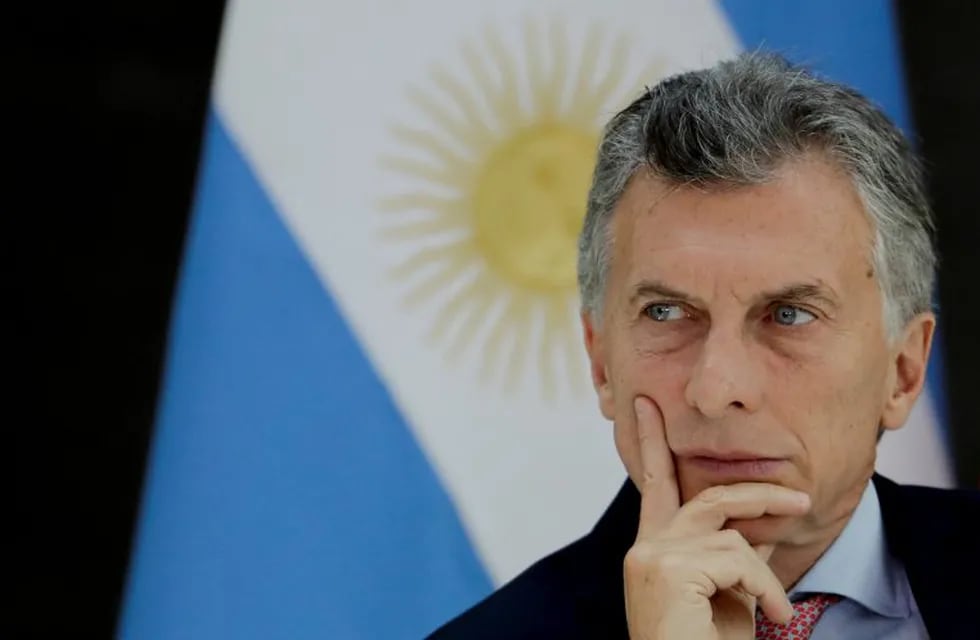 FILE - In this March 6, 2018, Argentina's President Mauricio Macri attends a luncheon at the government house Casa Rosada, in Buenos Aires, Argentina. Macri faces his last year of government in Argentina with a damaged image and the economy plunged into a deep recession. Even so the conservative president will seek re-election in 2019. (AP Photo/Natacha Pisarenko, File)