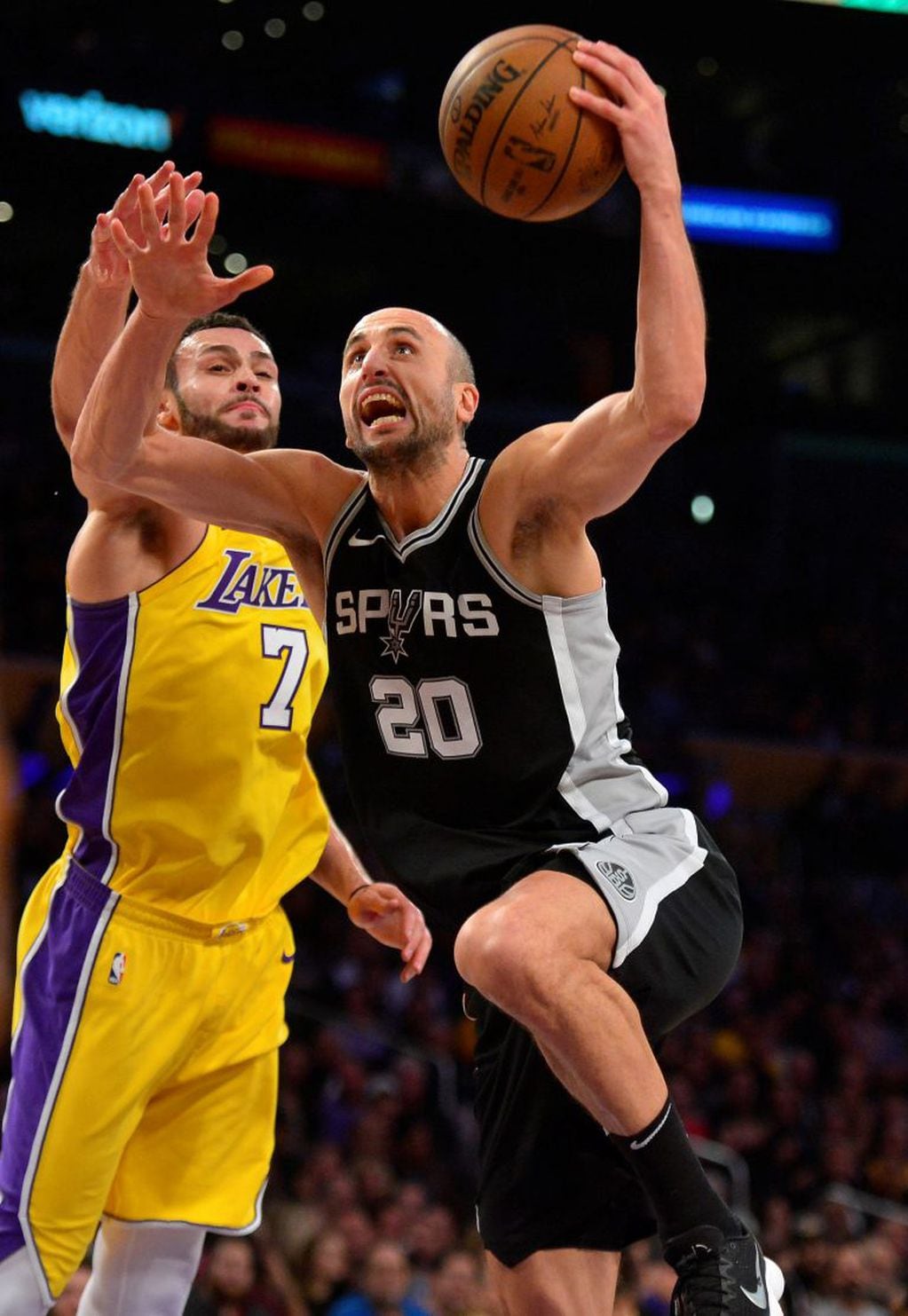 January 11, 2018; Los Angeles, CA, USA; San Antonio Spurs guard Manu Ginobili (20) moves to the basket against Los Angeles Lakers forward Larry Nance Jr. (7) during the second half at Staples Center. Mandatory Credit: Gary A. Vasquez-USA TODAY Sports