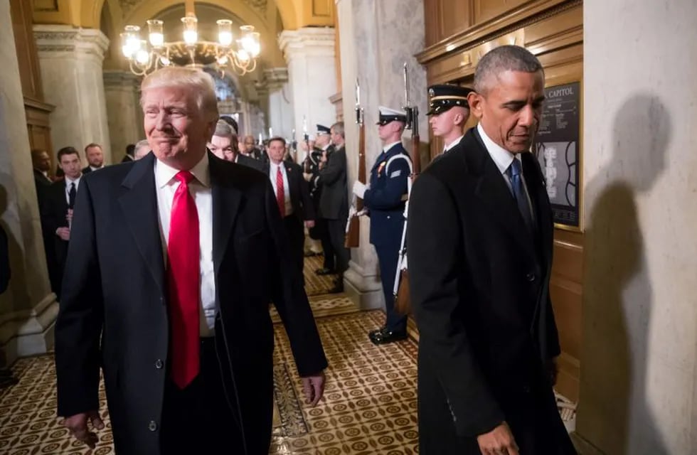FILE PHOTO - President-elect Donald Trump, left, and President Barack Obama arrive for Trump's inauguration ceremony at the Capitol in Washington, D.C., U.S. January 20, 2017. REUTERS/J. Scott Applewhite/Pool/File Photo