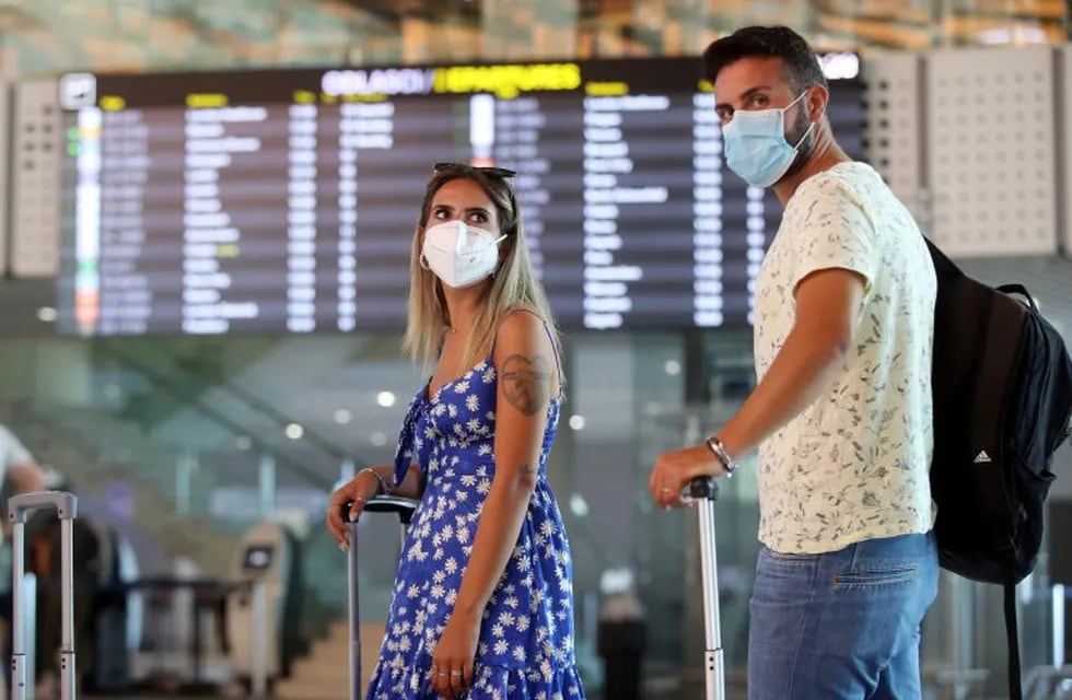 Tourists wearing face masks wait at Split International Airport in Split, Croatia, on August 21, 2020. - As United Kingdom removed Croatia from the list of \