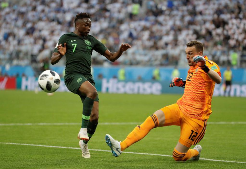 Nigeria's Ahmed Musa, left, and Argentina goalkeeper Franco Armani compete for the ball during the group D match between Argentina and Nigeria at the 2018 soccer World Cup in the St. Petersburg Stadium in St. Petersburg, Russia, Tuesday, June 26, 2018. (AP Photo/Dmitri Lovetsky)