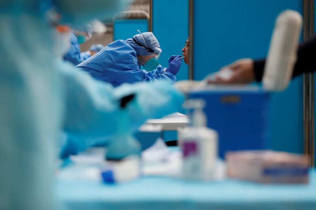 Journalists get tested for the coronavirus disease (COVID-19) before attending the closing session of the National People's Congress (NPC) in Beijing, China May 28, 2020. REUTERS/Carlos Garcia Rawlins