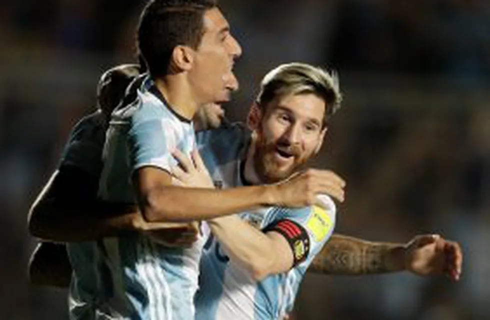 Argentina's Angel Di Maria, left, celebrates with teammate Lionel Messi, right, after Lucas Pratto, back, scored against Colombia during a 2018 World Cup qualifying soccer match in San Juan, Argentina, Tuesday, Nov. 15, 2016. Argentina won the match 3-0. 