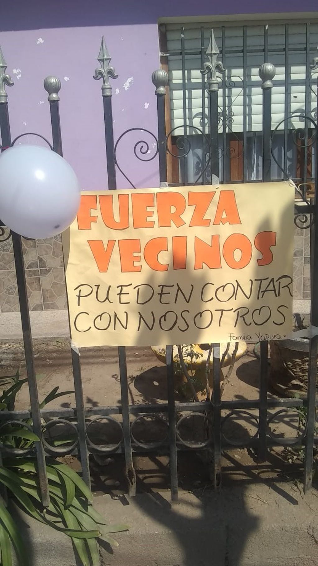 El cartel dedicado a vecinos en el barrio 1° de Mayo de Malagueño.