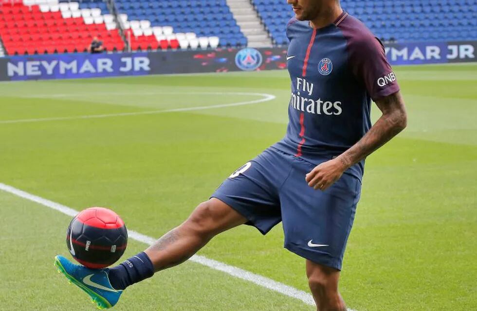 Brazilian soccer star Neymar controls the ball following a press conference in Paris Friday, Aug. 4, 2017. Neymar arrived in Paris on Friday the day after he became the most expensive player in soccer history when completing his blockbuster transfer to Paris Saint-Germain from Barcelona for 222 million euros ($262 million).(AP Photo/Michel Euler)