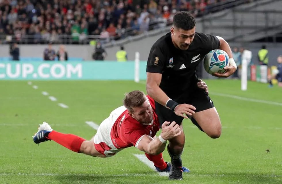 New Zealand's Richie Mo'unga runs to score a try during the Rugby World Cup bronze final game at Tokyo Stadium between New Zealand and Wales in Tokyo, Japan, Friday, Nov. 1, 2019. (AP Photo/Aaron Favila )