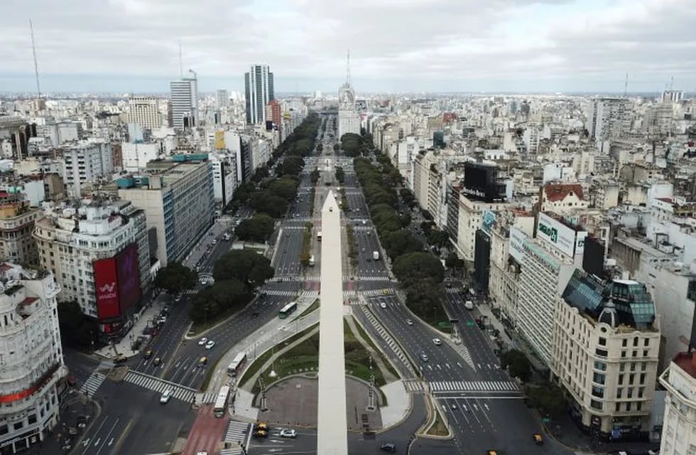 The 9 de Julio Boulevard is seen almost devoid of traffic during the return to a strict lockdown to curb the spread of COVID-19, in Buenos Aires, Argentina, Wednesday, July 1, 2020. After a brief relaxation of a government lockdown, authorities returned to tighter restrictions in the capital when cases spiked. (AP Photo/Victor R. Caivano)