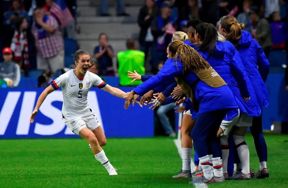 TOPSHOT - United States' defender Kelley O'Hara (L) celebrates after her team's second goal  during the France 2019 Women's World Cup Group F football match between Sweden and USA, on June 20, 2019, at the Oceane Stadium in Le Havre, northwestern France. (Photo by Damien MEYER / AFP)