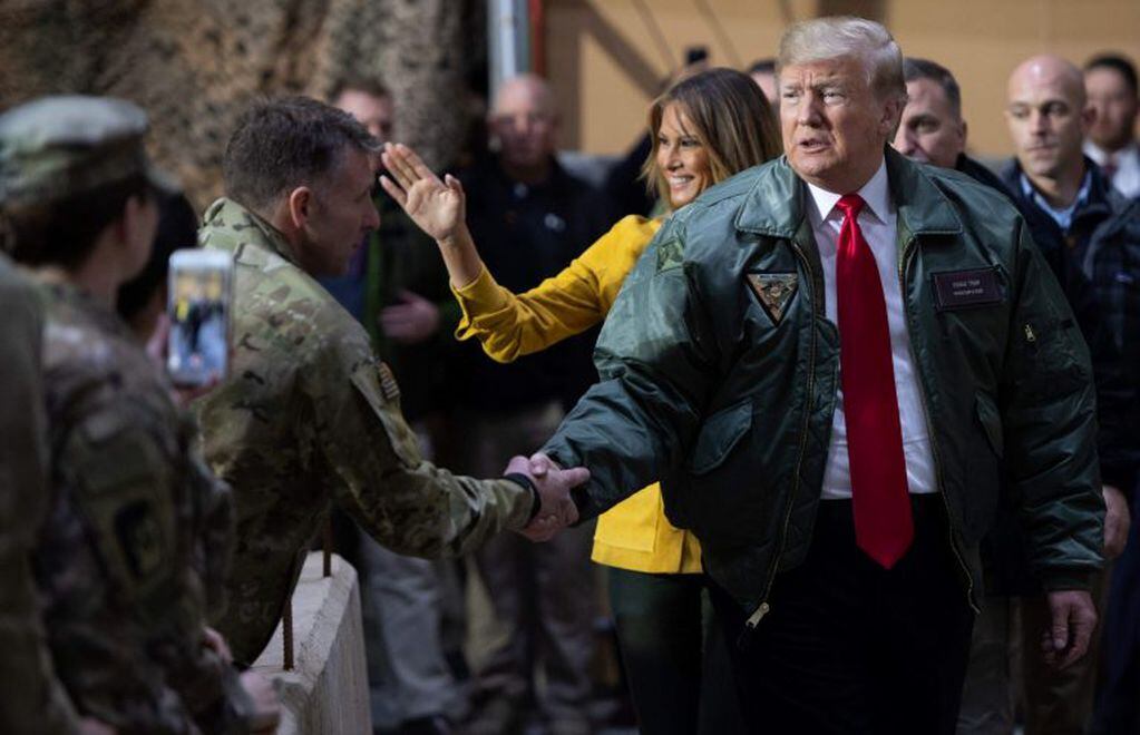 Donald y Melania Trump en la base Al Asad, en diciembre de 2018. (Foto: Saúl Loeb/AFP)