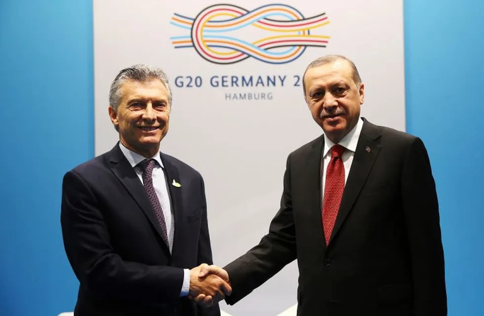 Turkey's President Recep Tayyip Erdogan, right, shakes hands with Argentina's President Mauricio Macri, left, prior to their meeting, during the G-20 summit in Hamburg, northern Germany, Saturday, July 8, 2017. (Turkish Presidency Press Service via AP, Pool)
