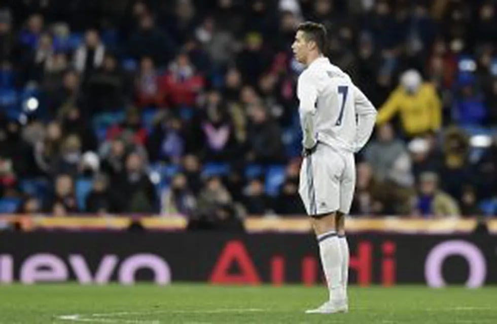 Real Madrid's Portuguese forward Cristiano Ronaldo stands on the pitch at the end of the Spanish Copa del Rey (King's Cup) quarter-final first leg football match Real Madrid CF vs RC Celta de Vigo at the Santiago Bernabeu stadium in Madrid on January 18, 