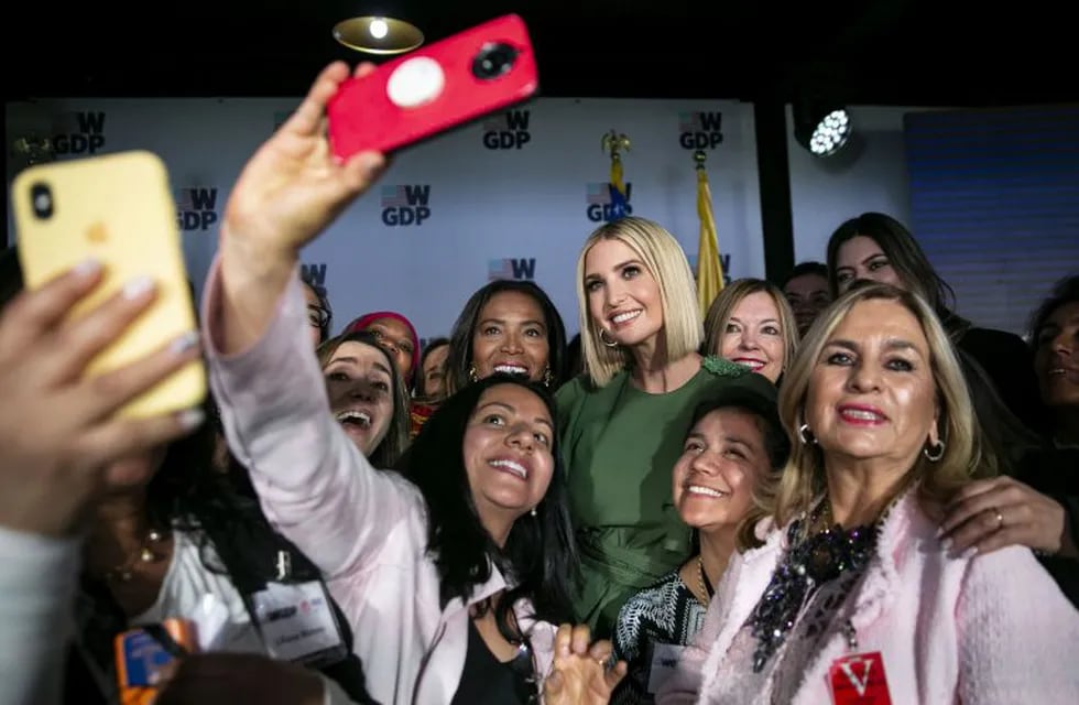 Attendees use mobile device to take 'selfie' photographs with Ivanka Trump, assistant to U.S. President Donald Trump, center, during the Academy for Women Entrepreneurs (AWE) launch event in Bogota, Colombia, on Tuesday Sept. 3, 2019. The AWE program, created in support of the Women's Global Development and Prosperity (W-GDP) Initiative, will equip women with the practical skills needed to create sustainable businesses and enterprises. Photographer: Al Drago/Bloomberg