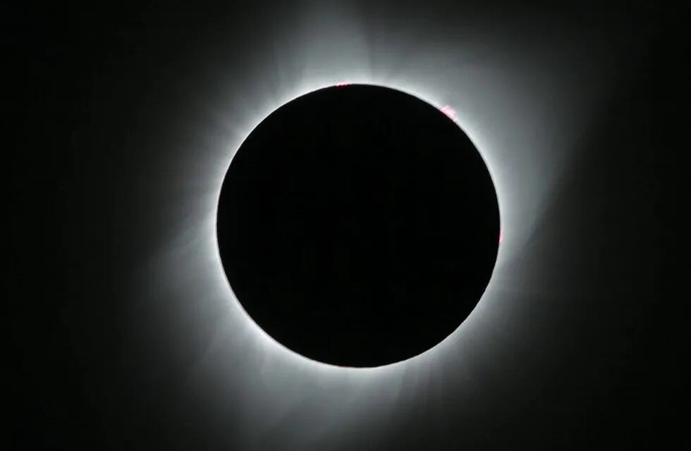 JACKSON, WY - AUGUST 21: The sun is is in full eclipse over Grand Teton National Park on August 21, 2017 outside Jackson, Wyoming. Thousands of people have flocked to the Jackson and Teton National Park area for the 2017 solar eclipse which will be one of the areas that will experience a 100% eclipse on Monday August 21, 2017.   George Frey/Getty Images/AFP\n== FOR NEWSPAPERS, INTERNET, TELCOS & TELEVISION USE ONLY ==