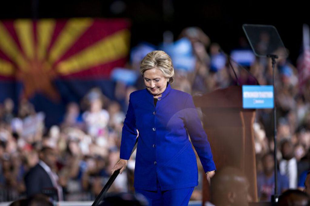 Hillary Clinton, 2016 Democratic presidential nominee, descends a flight of stairs as she leaves a campaign event in Tempe, Arizona, U.S., on Wednesday, Nov. 2, 2016. Clinton added a stop in Michigan and her campaign is pouring more money into advertising there and three other states once considered safe amid concerns among some Democrats that a new FBI review of a top aide's e-mails may erode her electoral firewall. Photographer: Daniel Acker/Bloomberg