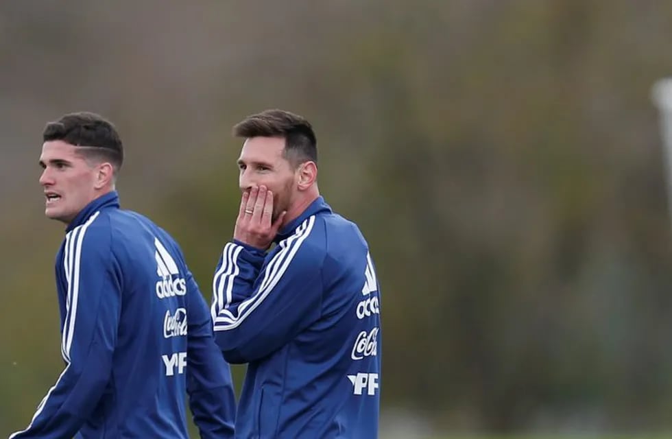 Argentina players Rodrigo De Paul, left, and Lionel Messi, walk off the pitch after a training session in Buenos Aires, Argentina, Thursday, May 30, 2019, ahead of the Copa America in neighboring Brazil. (AP Photo/Natacha Pisarenko)