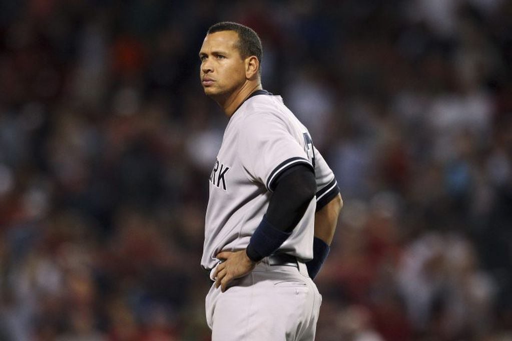 New York Yankees' Alex Rodriguez stands at third base in the eighth inning of their MLB American League baseball game against the Boston Red Sox in Boston, Massachusetts in this August 18, 2013 file photo. Rodriguez will be suspended for the entire 2014 M