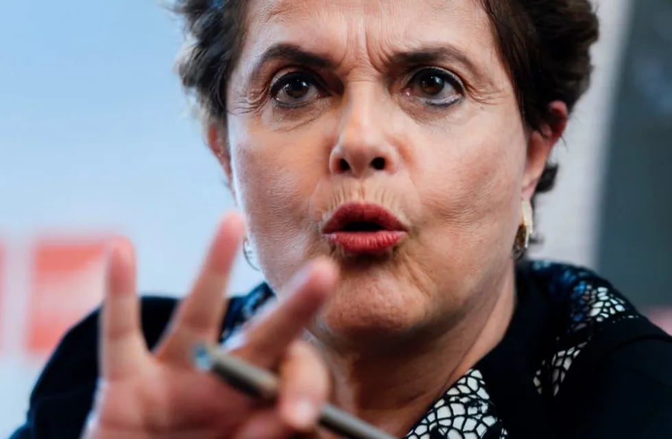 Former Brazilian president Dilma Rousseff gestures during a press conference at the International Federation for Human Rights film festival (FIDH) on March 11, 2017 in Geneva.nDilma Rousseff was ousted after the Senate controversially voted on August 31, 2016 to impeach her for illegally manipulating the national budget. / AFP PHOTO / Fabrice COFFRINI