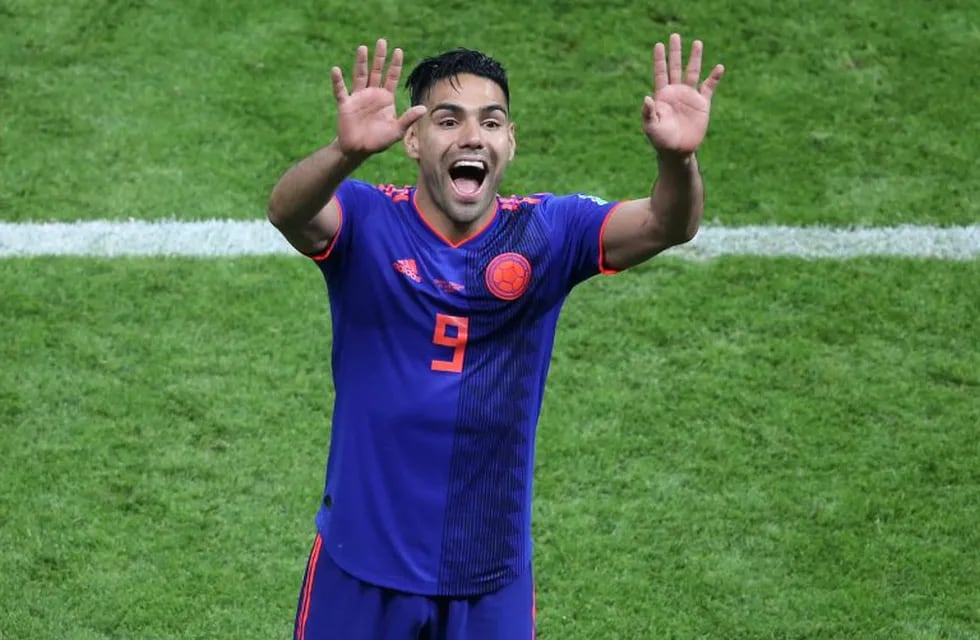 Colombia's forward Falcao celebrates their victory at the end of the Russia 2018 World Cup Group H football match between Poland and Colombia at the Kazan Arena in Kazan on June 24, 2018. / AFP PHOTO / Roman Kruchinin / RESTRICTED TO EDITORIAL USE - NO MOBILE PUSH ALERTS/DOWNLOADS