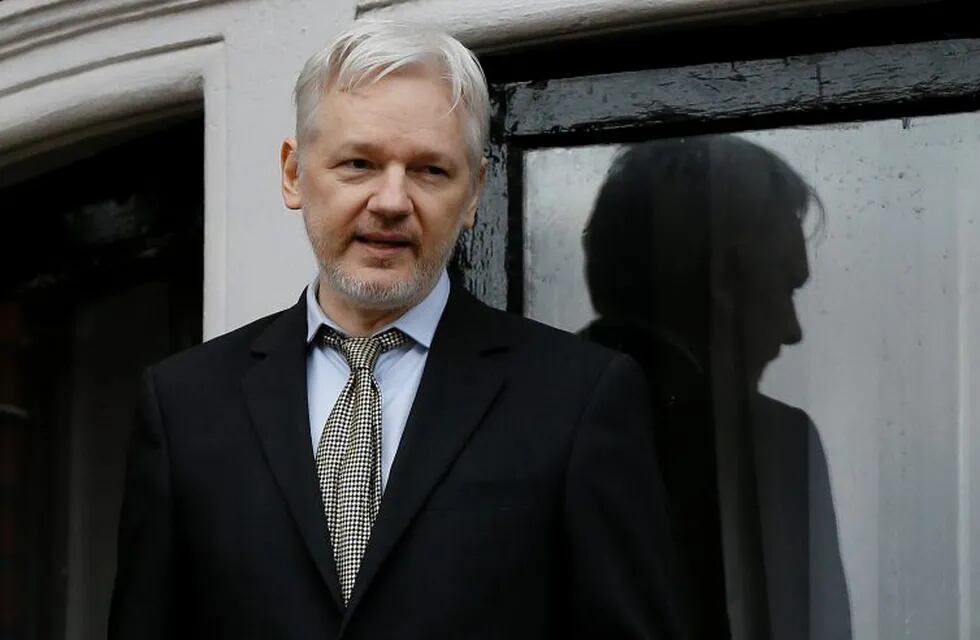 FILE - In this Feb. 5, 2016 file photo, WikiLeaks founder Julian Assange speaks from the balcony of the Ecuadorean Embassy in London. Assange will be interviewed about Swedish sex crime allegations at the Ecuadorean Embassy in London on Monday, Nov. 14, 2