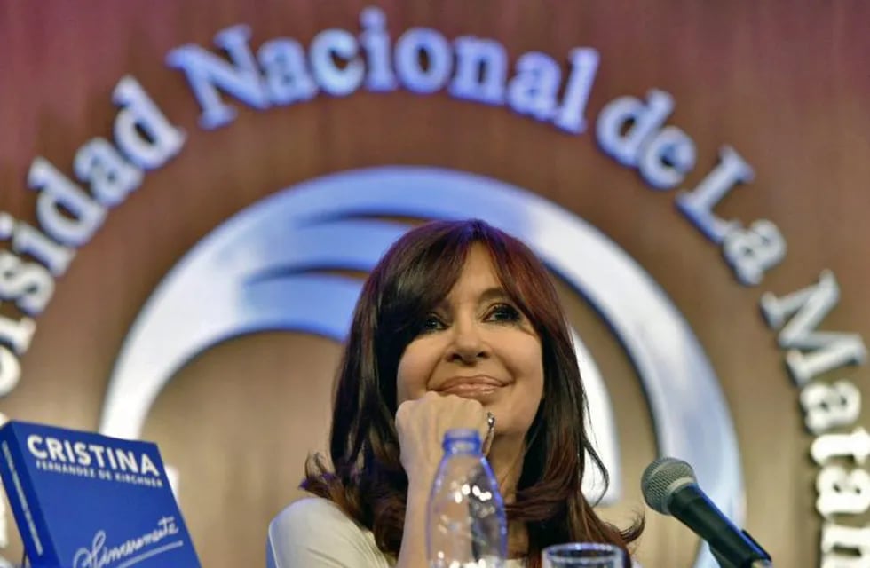 Handout photo released by Cristina Fernandez de Kirchner press service of Argentinian former President (2007-2015) and vice-presidential candidate for the Frente de Todos party, Cristina Kirchner, next to her book \