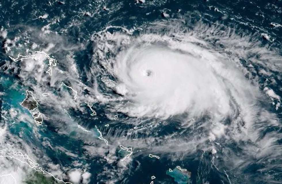 This satellite image obtained from NOAA/RAMMB, shows Tropical Storm Dorian as it approaching the Bahamas and Florida at 13:430UTC on August 31, 2019. - Dorian changed course slightly on Saturday, possibly putting it on track to hit the Carolinas rather than Florida as previously forecast, after a dangerous blast through the Bahamas. Meteorologists said Dorian has grown into an extremely dangerous Category 4 storm as it heads toward land. (Photo by HO / NOAA/RAMMB / AFP) / RESTRICTED TO EDITORIAL USE - MANDATORY CREDIT \