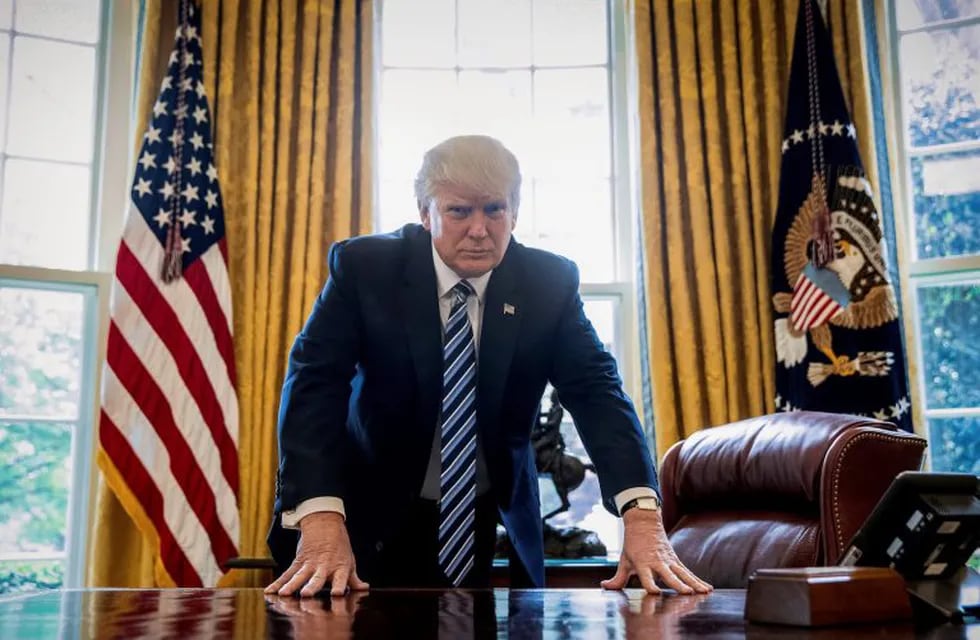 President Donald Trump poses for a portrait in the Oval Office in Washington, Friday, April 21, 2017. With his tweets and his bravado, Trump is putting his mark on the presidency in his first 100 days in office. He's flouted conventions of the institution