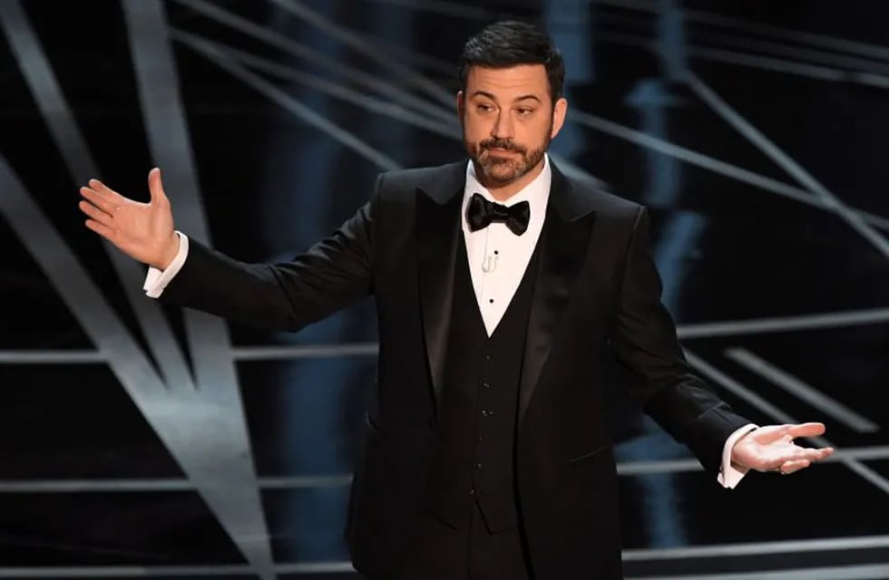 (FILES) This file photo taken on February 26, 2017 shows Host Jimmy Kimmel on stage at the 89th Oscars in Hollywood, California.nLate night funnyman Jimmy Kimmel will return to host the Oscars, the Academy said May 16, 2017, as the glitzy annual show moves on from the biggest mix-up in its history. The 49-year-old comedian will be reunited with producers Michael De Luca and Jennifer Todd for the 90th Academy Awards, which will take place on March 4, 2018.n / AFP PHOTO / Mark RALSTON