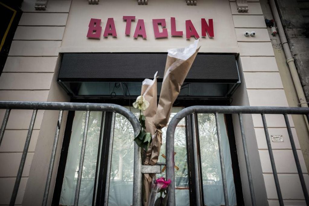 (FILES) This file photo taken on November 01, 2016 shows flowers tied to a fence outside the "Bataclan" concert hall during All Saints' day in Paris, one of the targets of the November 13, 2015 terrorist attacks during which 130 people were killed and ano