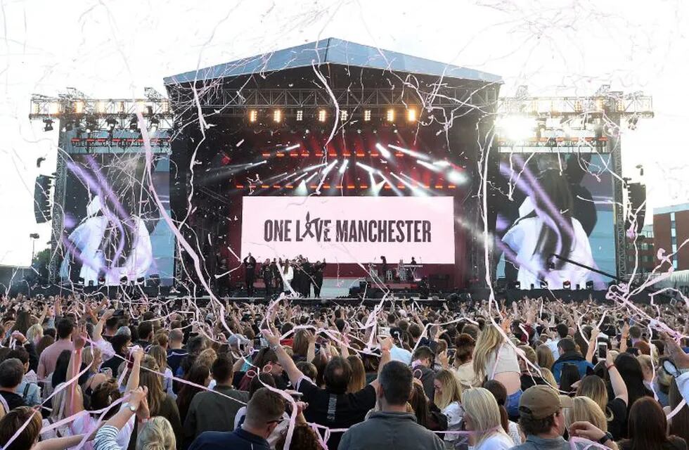 In this photograph released by One Love Manchester on June 4, 2017, music fans gather at the One Love Manchester benefit concert for the families of the victims of the May 22, Manchester terror attack, at Emirates Old Trafford in Greater Manchester on June 4, 2017.  / AFP PHOTO / One Love Manchester / Dave Hogan for One Love Manchester / RESTRICTED TO EDITORIAL USE - MANDATORY CREDIT 