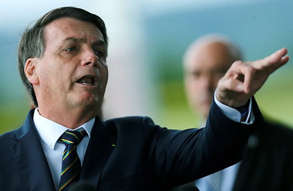 20 April 2020, Brazil, Rio de Janeiro: Brazilian President Jair Bolsonaro gestures as he speaks to media while leaving the Alvorada Palace. Photo: -/GDA via ZUMA Wire GDA via ZUMA Wire/dpa