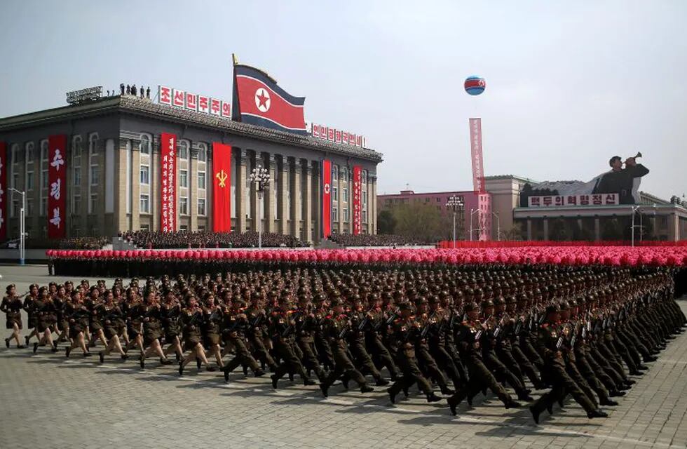 FILE- In this Saturday, April 15, 2017, file photo, soldiers march across Kim Il Sung Square during a military parade in Pyongyang, North Korea to celebrate the 105th birth anniversary of Kim Il Sung, the country's late founder and grandfather of current ruler Kim Jong Un. Thousands of North Korean laborers work in four U.S.-allied nations in the Persian Gulf, earning hard currency for Pyongyang despite international sanctions as pressure grows over its nuclear weapons program.  (AP Photo/Wong Maye-E, File)