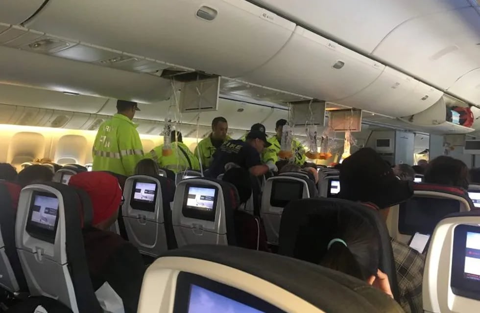 Emergency workers assist passengers of Air Canada AC 33 flight, which diverted to Hawaii after turbulence, at Honolulu airport, Hawaii, U.S., July 11, 2019 in this image obtained from a social media. Australian Band – Hurricane Fall via REUTERS ATTENTION EDITORS - THIS IMAGE HAS BEEN SUPPLIED BY A THIRD PARTY. NO RESALES. NO ARCHIVES. MANDATORY CREDIT