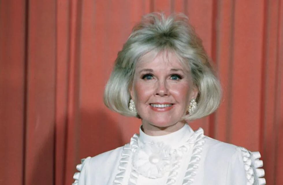 FILE - In this Jan. 28, 1989 file photo, actress and animal rights activist Doris Day poses for photos after receiving the Cecil B. DeMille Award she was presented with at the annual Golden Globe Awards ceremony in Los Angeles. Day, whose wholesome screen presence stood for a time of innocence in '60s films, has died, her foundation says. She was 97. The Doris Day Animal Foundation confirmed Day died early Monday, May 13, 2019, at her Carmel Valley, California, home. (AP Photo, File)
