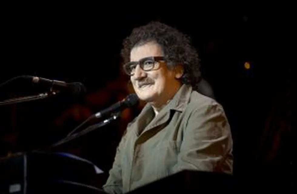 FILE - In this Dec. 6, 2012 file photo, Argentina's rock singer and composer Charly Garcia performs in concert in Buenos Aires, Argentina. Garcia was admitted to a clinic in Bogota, Colombia late Friday, Nov. 15, 2013 for high blood pressure, and will be 