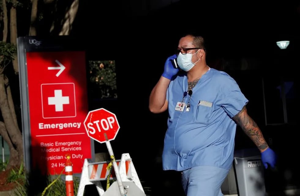 A hospital worker walks out of a garage amid an outbreak of the coronavirus disease (COVID-19), at the University of California San Francisco Parnassus campus in San Francisco, California, U.S., April 1, 2020. REUTERS/Shannon Stapleton