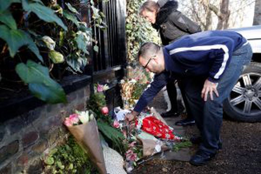 Fans leave tributes outside the home of British musician George Michael in London, Monday, Dec. 26, 2016. George Michael, who rocketed to stardom with WHAM! and went on to enjoy a long and celebrated solo career lined with controversies, has died, his publicist said Sunday. He was 53. (AP Photo/Kirsty Wigglesworth)