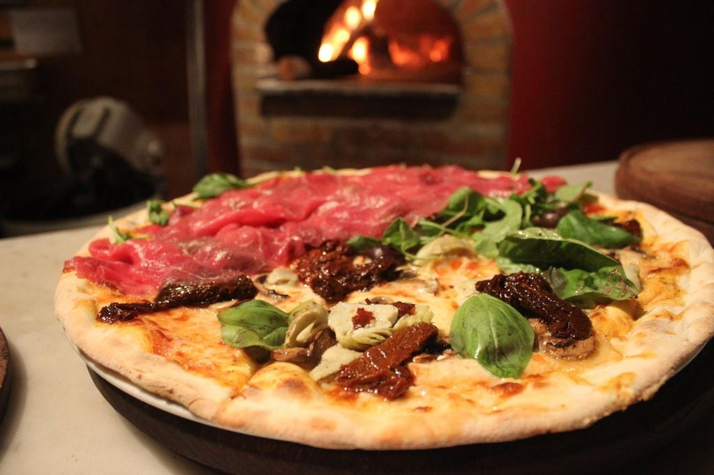 Con más de 20 sucursales, la pizzería Piola es elegida por turistas y locales.