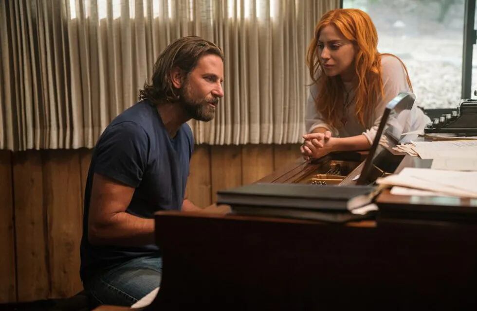 This image released by Warner Bros. Pictures shows Bradley Cooper, left, and Lady Gaga in a scene from \