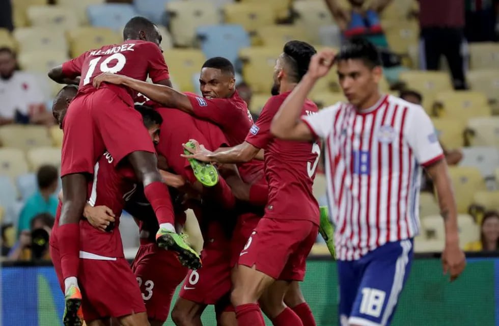 Qatar players celebrate their side's second goal against Paraguay, scored by Boualem Khoukhi, during a Copa America Group B soccer match at the Maracana stadium in Rio de Janeiro, Brazil, Sunday, June 16, 2019. (AP Photo/Silvia Izquierdo)