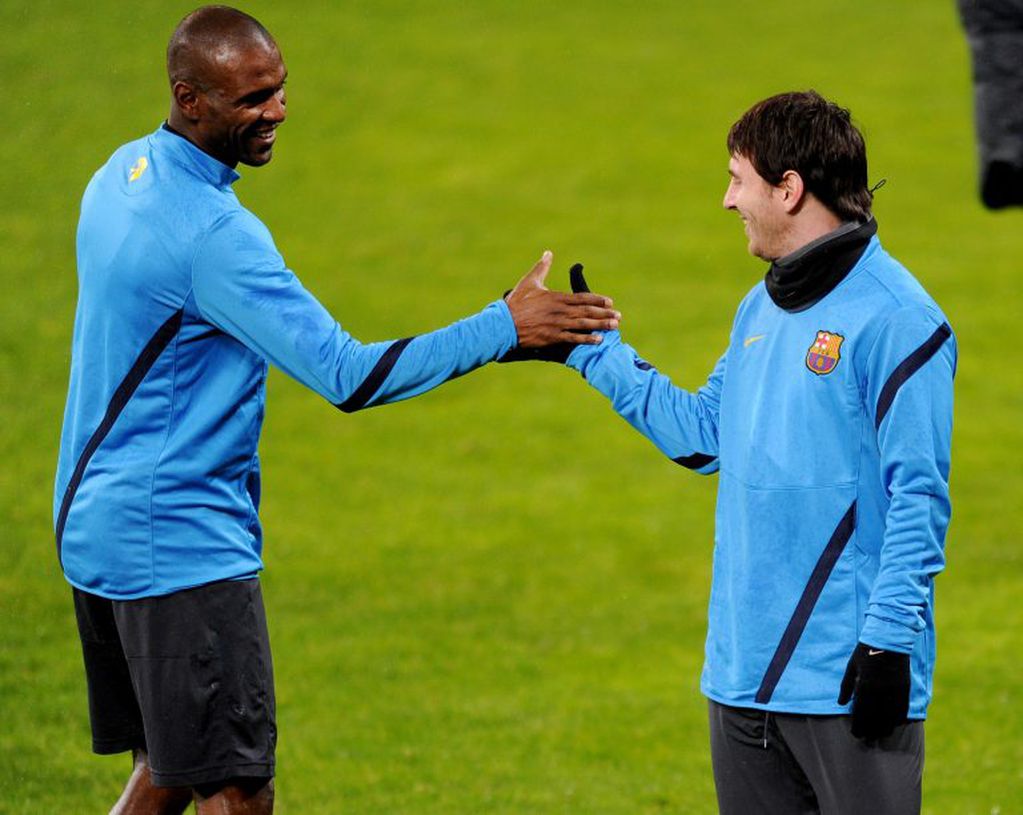 Barcelona´s French  defender Eric Abidal (L) and Barcelona´s Argentinian striker Lionel Messi take part in a training session prior to the UEFA Champions League round of sixteen first leg match of German first division football club Bayer Leverkusen vs FC Barcelona at the BayArena stadium on February 13, 2011 in Leverkusen, western Germany. The match will take place on February 14, 2012.  AFP PHOTO / PATRIK STOLLARZ
 Leverkusen alemania Lionel Messi Eric Abidal futbol copa uefa liga de campeones futbol europeo entrenamiento futblistas FC Barcelona