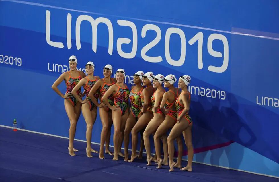 The synchronized swimming team of Cuba poses for a photo after their training session at the Pan Am Games in Lima, Peru, Thursday, July 25, 2019. (AP Photo/Fernando Vergara)
