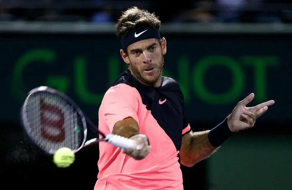 KEY BISCAYNE, FL - MARCH 28: Juan Martin Del Potro of Argentina returns a shot against Milos Raonic of Canada during their quarterfinal match on Day 10 of the Miami Open Presented by Itau at Crandon Park Tennis Center on March 28, 2018 in Key Biscayne, Florida.   Michael Reaves/Getty Images/AFP\n== FOR NEWSPAPERS, INTERNET, TELCOS & TELEVISION USE ONLY ==