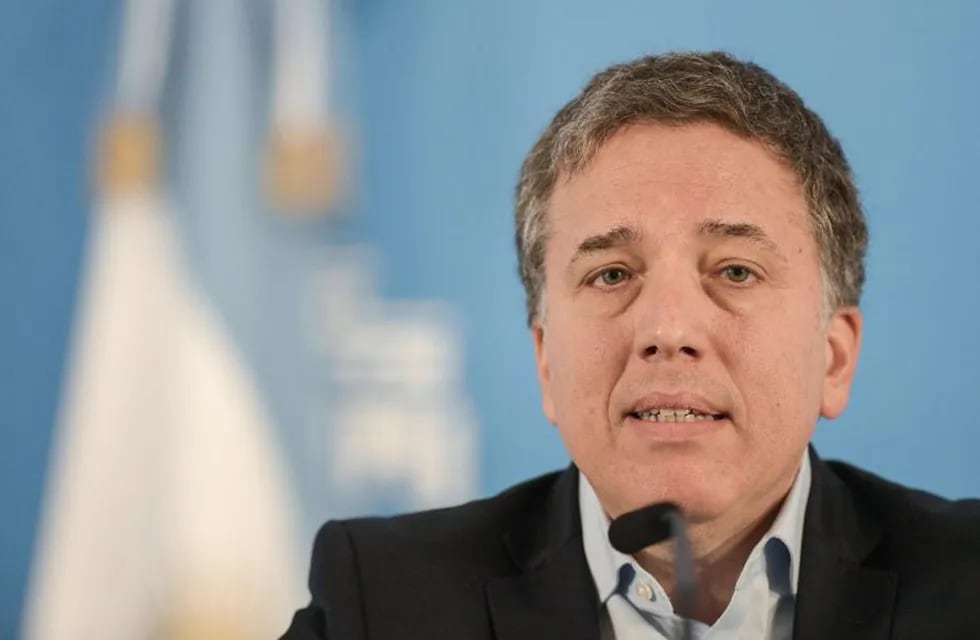 (FILES) In this file photo taken on April 17, 2019 Argentinian Economy Minister, Nicolas Dujovne, talks during a press conference at the presidential residence in Olivos, Buenos Aires. - Argentine Economy Minister Nicolas Dujovne resigned from his position on August 17, 2019 and will be replaced by Hernan Lacunza, according to Argentinian media reports. (Photo by JUAN MABROMATA / AFP)