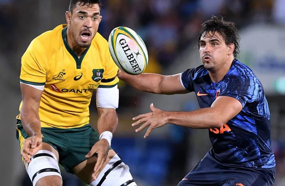 Argentina's Nicolas Sanchez, center, tackles Australia's Israel Folau during their rugby union test match in the Gold Coast, Australia, Saturday, Sept. 15, 2018. (AP Photo/Dave Kapernick)