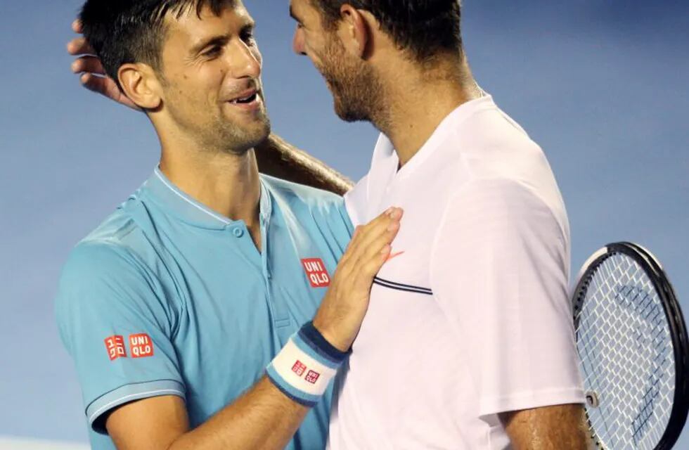 Serbia's Novak Djokovic, left, embraces Argentina's Juan Martin Del Potro at the end their Mexican Tennis Open match in Acapulco, Mexico, Wednesday, March 1, 2017. Djokovic defeated Del Potro in three sets 4-6, 6-4, 6-4 early on Thursday to advance to the